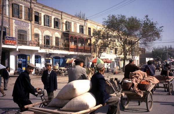 photo of China, Xinjiang province (East Turkestan), Kashi, Uygur peasants with horse (or donkey) and carriage on their way to the huge Kashgar Sunday market where more than 150.000 salesmen and buyers find each other