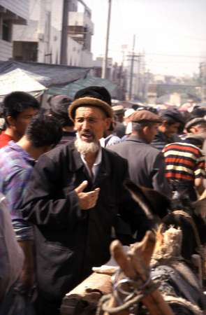 photo of China, Xinjiang province (East Turkestan), Kashi, Uygur man on the Kashgar Sunday market 