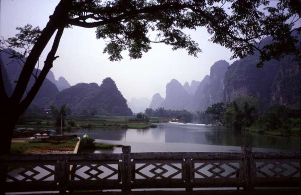photo of China, Guanxi Region, landscape around Yangshuo and Guilin. The limestone, weathered and eroded by water, became today's fantastic stone forests, peaks, underground streams and caves, thus giving unique features to Guilin's scenery