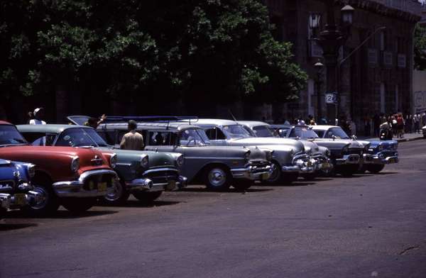 photo of Cuba, Cuban American oldtimers parked in the centre of Havana