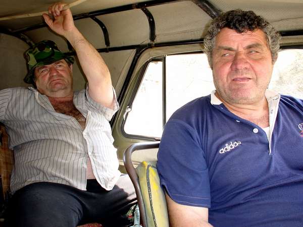 photo of Republic of Georgia, Racha, Region of Oni, two villagers in a UAZ