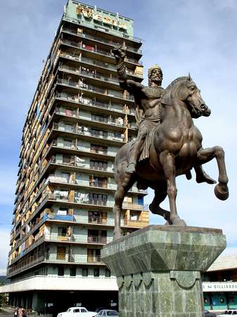 photo of Republic of Georgia, Tbilisi, Rustaveli avenue, statue of Davit the builder in front of the Iveria hotel, the Iveria is one of the many old Soviet hotels where Georgians have helped the Georgian refugees from Abkhazia with a temporary home