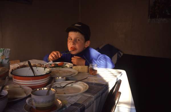 photo of Republic of Georgia, Svaneti, child having dinner