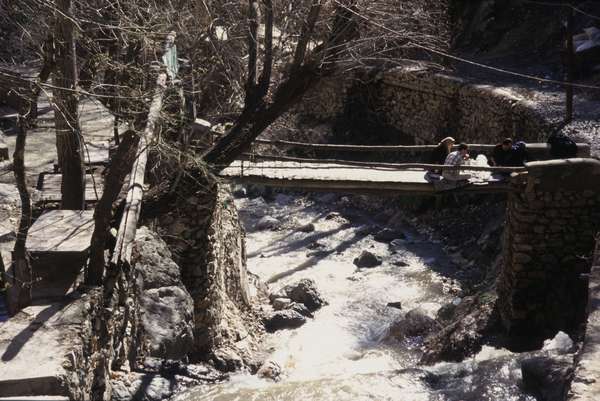 photo of Iran, Tehran (Teheran), hang bridge over river along the path up the mountain at Tochal (touchal)