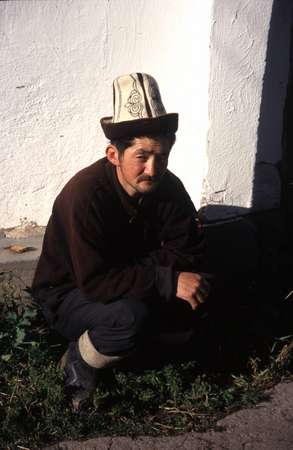 photo of Kyrgyzstan, around Karakol, Kyrgyz man with a kalpak, the traditional Kyrgyz hat which is made of felt and is usually white with a black rim
