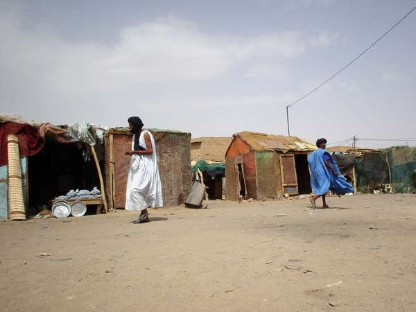 photo of Mauritania, market of Atar, men in white and blue kaftan (Bou-Bou) dress