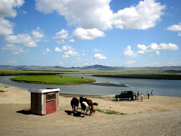 photo of Mongolia, Mongolian landscape with horses, a Russian UAZ jeep and a river along the road from Ulaanbaatar to Kharkhorin - Karakorum