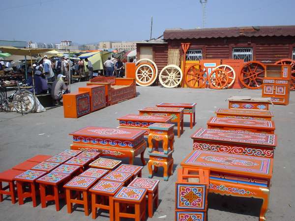 photo of Mongolia, 'black market' in Ulaanbaatar, selling traditional orange decorated Mongolian yurt furniture and wooden roof rings (toghona) for their gers (tents, yurts)