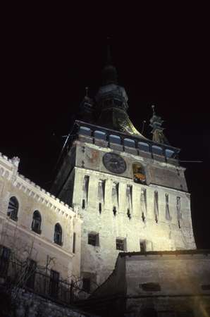 photo of Romania, Transylvania, Sighisoara, 14th century clock tower by night, the entrance of the citadel