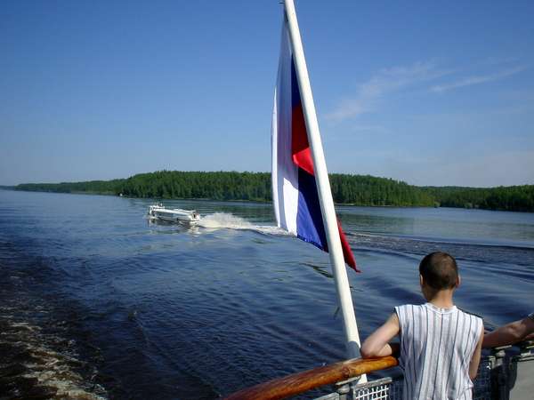 photo of Russia, Siberia, around Khanty Mansiysk, russian flag and raketa speed boat on the river Ob