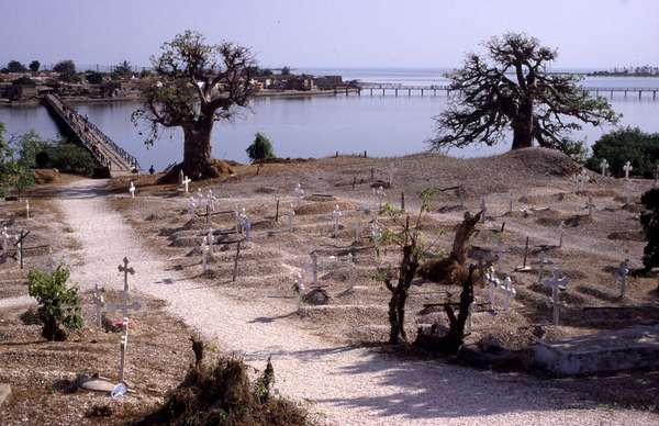 photo of Senegal, Joal Fadiouth (Joal-Fadiout) shell island connected by wooden bridge, graveyard with muslim and christian cemeteries built with shells