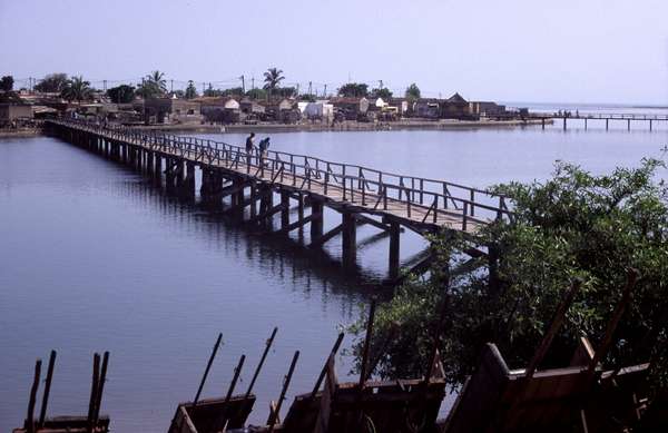 photo of Senegal, Petite Côte, Joal Fadiouth (Joal-Fadiout), wooden walking bridge connecting the artificial shell island, with Fadiouth Island