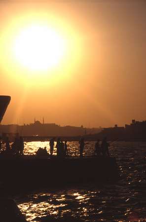 photo of Turkey, Istanbul, sunset over the Bosphorus and fishermen