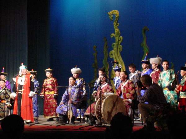 photo of Tuva, Kyzyl, theatre, Dembildei Khoomei festival 2002, overtone singer Kongar-Ol Ondar (left) celebrating his 40 th birthday with other Tuvan musicians on this throat singing festival