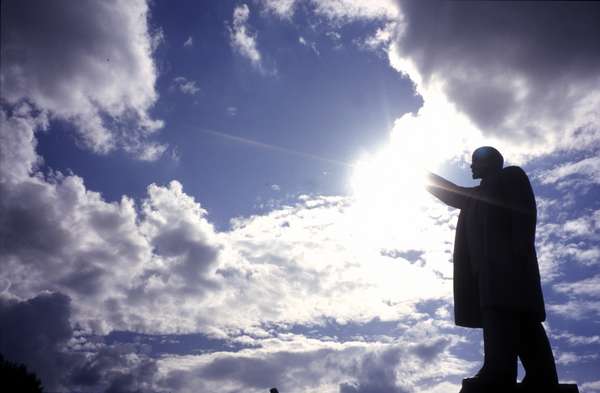 photo of Tuva, central Kyzyl, theatre square, "Lenin phone home", Soviet statue of Lenin touching the sun and the clouds