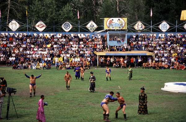 photo of Tuva, Kyzyl, traditional Tuvan wrestlers in the stadium of Kyzyl