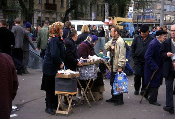 photo of Ukraine, Kiev, Podil street food, women selling dumplings known as piroshki, pelmeni or vareniki, pies stuffed with meat or vegetables