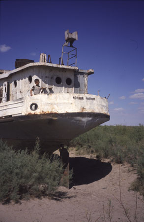 photo of Uzbekistan, Karakalpakstan, around Moynaq (Moynak, Muynak), a former fishing village on the shores of the Aral Sea, shipwreck of an abandoned boat on the dried out bottom of the Aral lake, once the fourth biggest lake in the world, now an environmental disaster