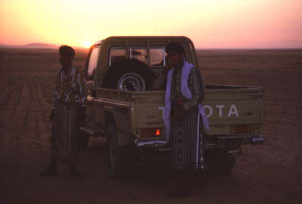 photo of South Yemen, sunrise, tribal bedouins with Toyota Hilux in the desert between Marib and Wadi Hadramaut