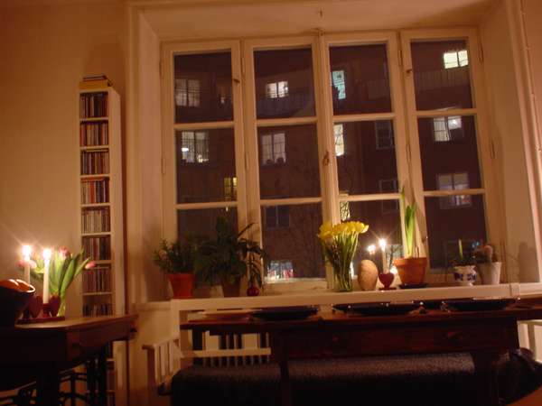 photo of Sweden, Stockholm, typical interior of a Swedish house : white walls, light wood, old double windows and lots of candles to cosy up the long dark winter days