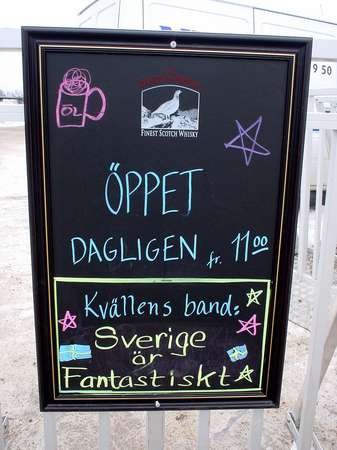 photo of Sweden, Mora, board in front of a pub 'band of the evening : Sweden is fantastic'; Swedes adore their country