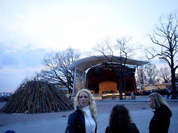 photo of Sweden, Stockholm, Skansen, blond Swedish girls waiting for the huge fire of Walpurgis Night (Valborgsmässoafton, 30 april) to be lit on, by then the podium behind will be filled with folk singers