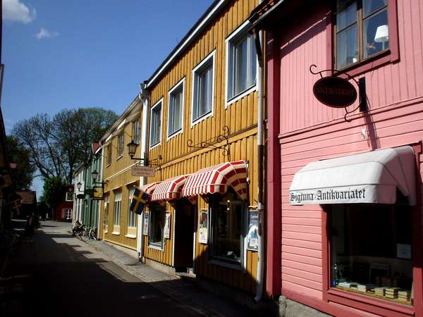 photo of Sweden, around Stockholm, street with colorful wooden houses in Sigtuna, the oldest town in Sweden