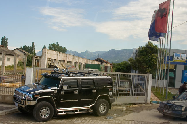 Albania photo of Tirana: Hummer luxury car and Albanian flag. New rich Albanians.