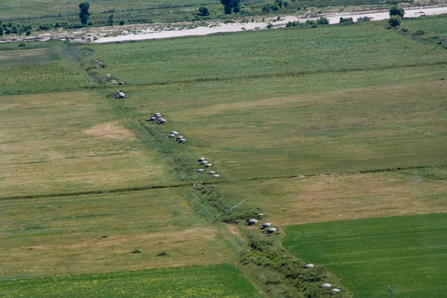 Albania photo: Row of Communist era defensive Albanian bunkers. Concrete dome shelter - bunker built during Enver Hoxha's rule all over Albania as protection against a foreign invasion. 