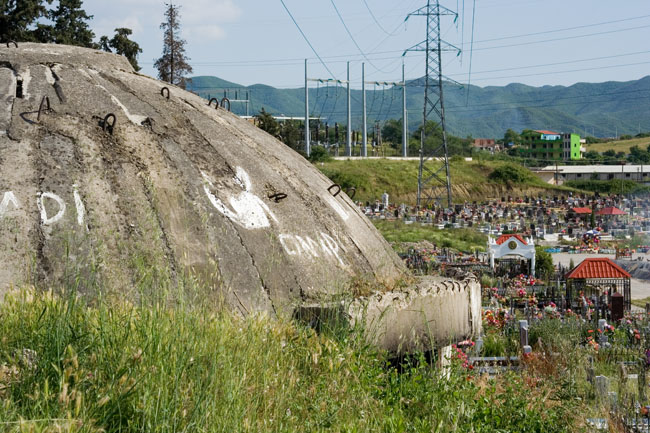 Albania photo Tirana main cemetery : Communist era defensive Albanian bunker. Concrete dome shelter built during Enver Hoxha's rule all over Albania as protection against a foreign invasion. Varreza e Sharrës cemetery. 