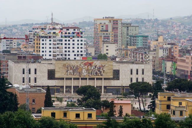 Albania panorama photo of Tirana: mosaic mural on Sheshi Skënderbej (Skanderbeg square), facade of the national museum of history. The mural entitled Albania shows Albanians victorious from Illyrian times to World War II 